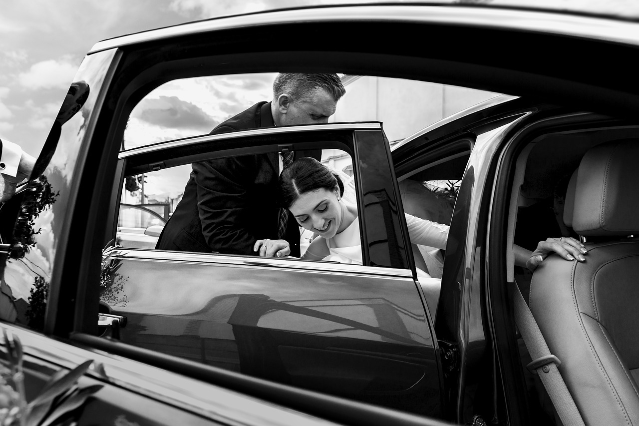 A bride leaving a car