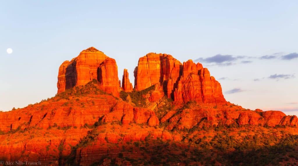Cathedral Rock in Sedona, Arizona, glowing at sunset with dramatic red rock formations and one of the region's most iconic landscape