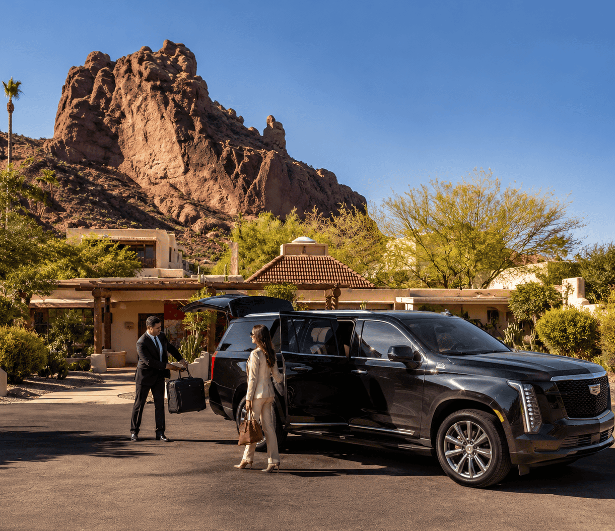 Luxury chauffeur service in Paradise Valley with Cadillac Escalade at a luxury estate near Camelback Mountain