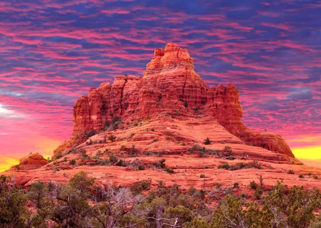 Bell Rock in Sedona, Arizona at sunset with vibrant red rock formations and colorful desert skies.