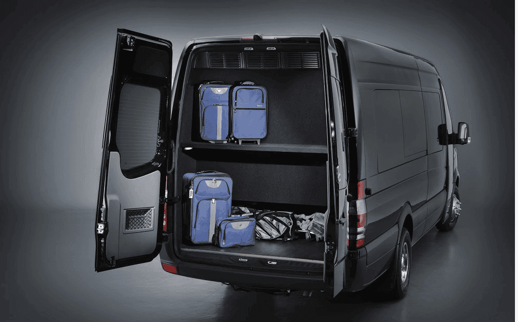 Mercedes Sprinter luggage capacity with rear cargo area loaded with suitcases