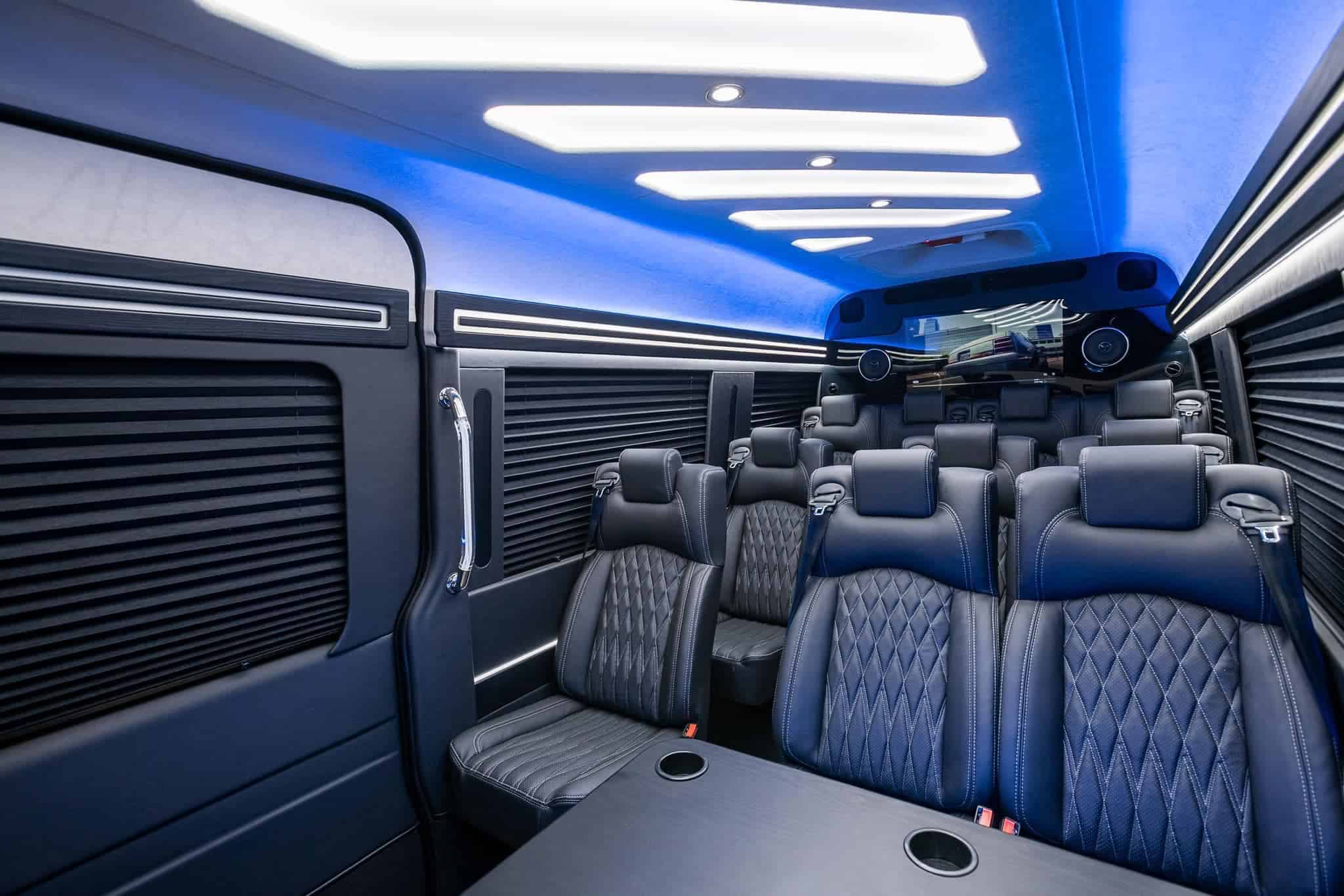 Executive Mercedes Sprinter interior with luxury leather seating and ambient lighting