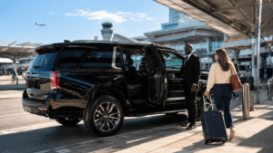 Phoenix Sky Harbor airport transportation chauffeur assisting passenger with private SUV pickup
